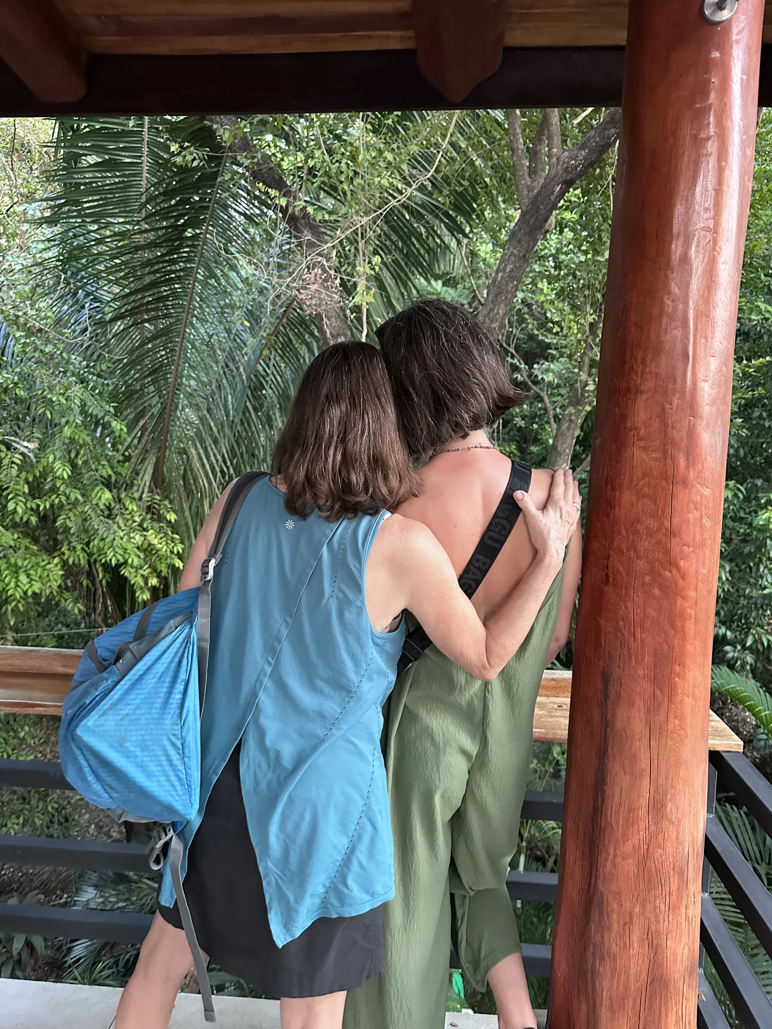 Away Retreats guests hugging on a jungle deck in Costa Rica